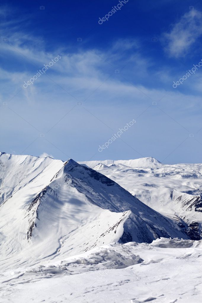 Snowy mountains at sunny day