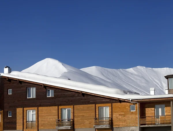 Hotel in snow at winter mountains Stock Picture