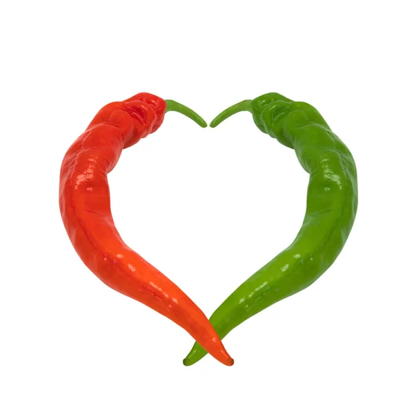 Red and green chili peppers in love — Stock Photo, Image