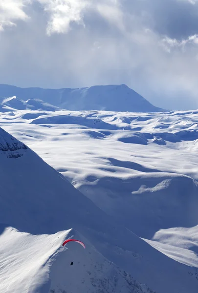 Speed flying in winter evening mountains — Stock Photo, Image