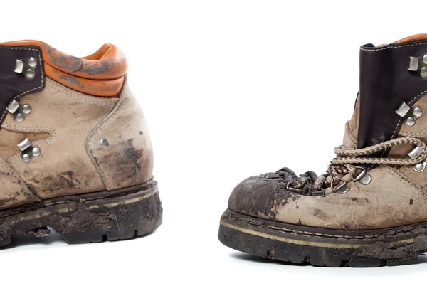 Old dirty hiking boots on white background — Stock Photo, Image