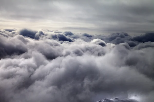 Top of off-piste slope in storm clouds — Stock Photo, Image