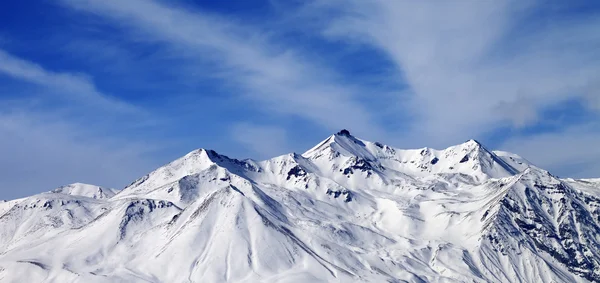 Panoramic view on winter snowy mountains in windy day — Stock Photo, Image