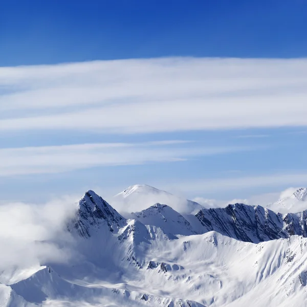 Snowy mountains in haze — Stock Photo, Image