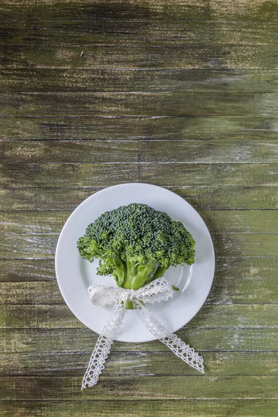 Broccoli tied with lace ribbon — Stock Photo, Image