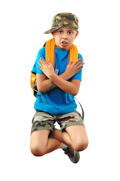Cool boy with backpack and a cap jumping — Stock Photo, Image