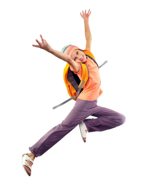 Schoolgirl with backpack and a cap jumping — Stock Photo, Image