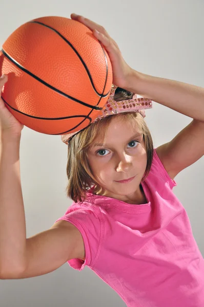 young basketball player makes a throw