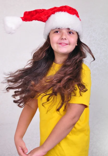 Child with Santa Claus red hat — Stock Photo, Image