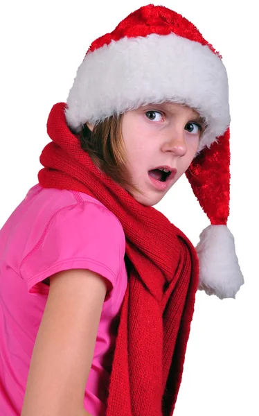 Překvapení nebo zklamaně dítě s santa claus red hat — Stock fotografie