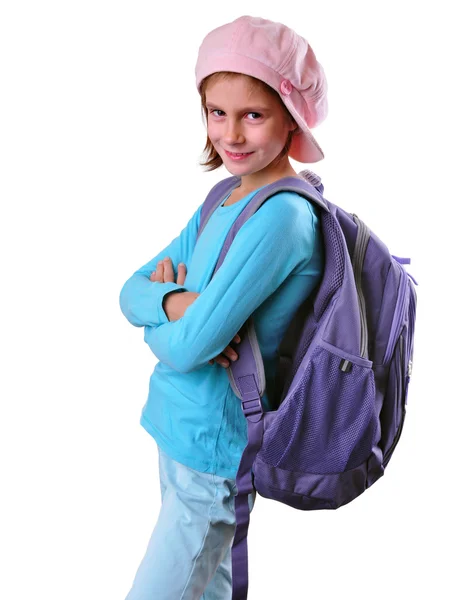 Ученик начальной школы с рюкзаком и книгами — стоковое фото