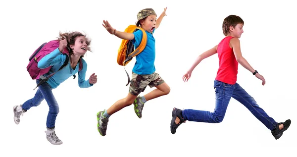 Grupo de crianças da escola feliz ou viajantes correndo juntos Imagem De Stock