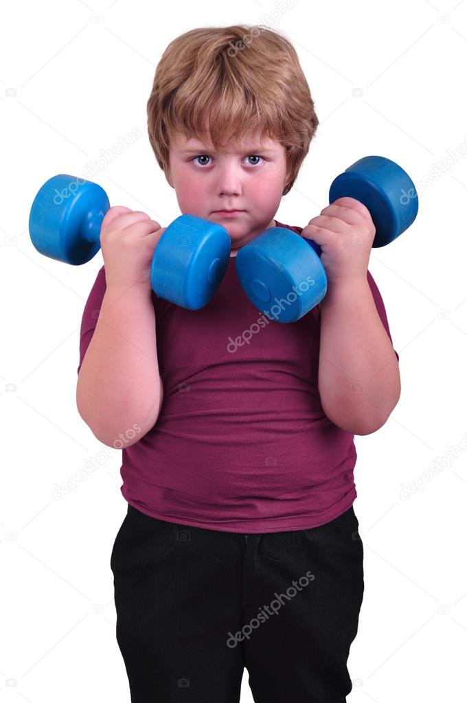 isolated portrait of kid exercising with dumbbells 