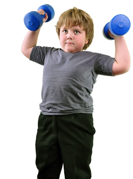 Isolated portrait of elementary age boy with dumbbells exercising — Stock Photo, Image