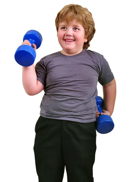 İzole dumbbells ile egzersiz gülümseyen çocuk portresi — Stok fotoğraf