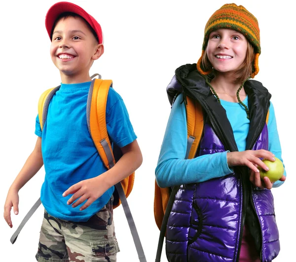 Happy smiling schoolgirl and boy with backpacks isolated — Stock Photo, Image