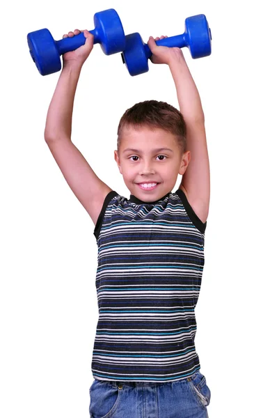 Retrato aislado de niño de edad elemental con pesas haciendo ejercicio —  Fotos de Stock