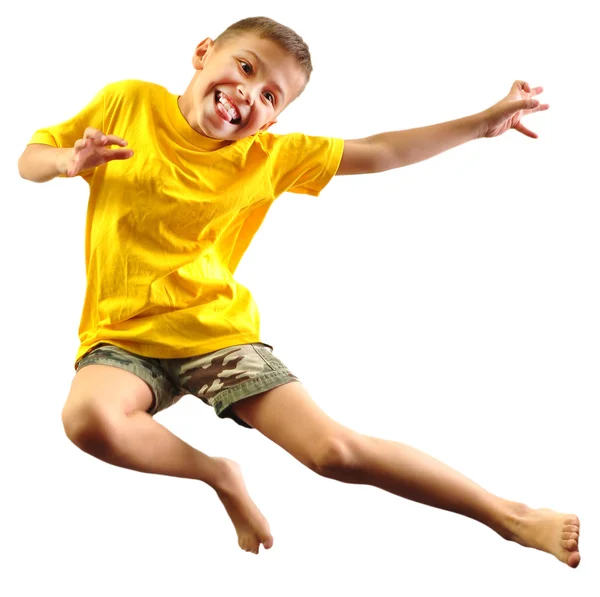 Bonito menino exercitando e pulando sobre branco — Fotografia de Stock