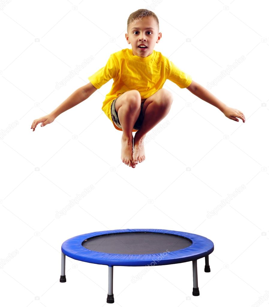 Cute boy exercising and jumping on a trampoline