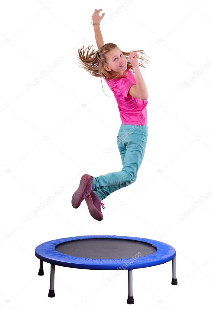 Pretty girl exercising and jumping on a trampoline