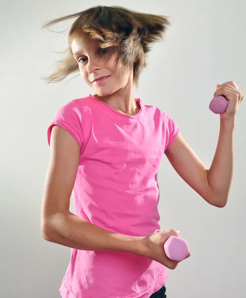 Child exercising with dumbbells — Stock Photo, Image