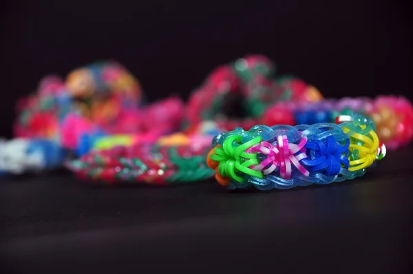 Rainbow colors rubber bands loom bracelets — Stock Photo, Image
