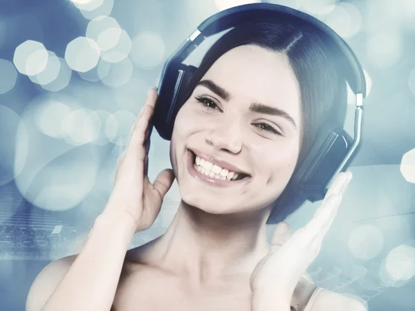 Beautiful young girl listening to music