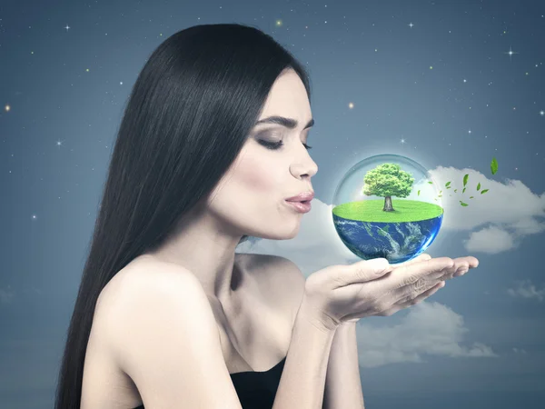 Girl holding green planet — Stock Photo, Image