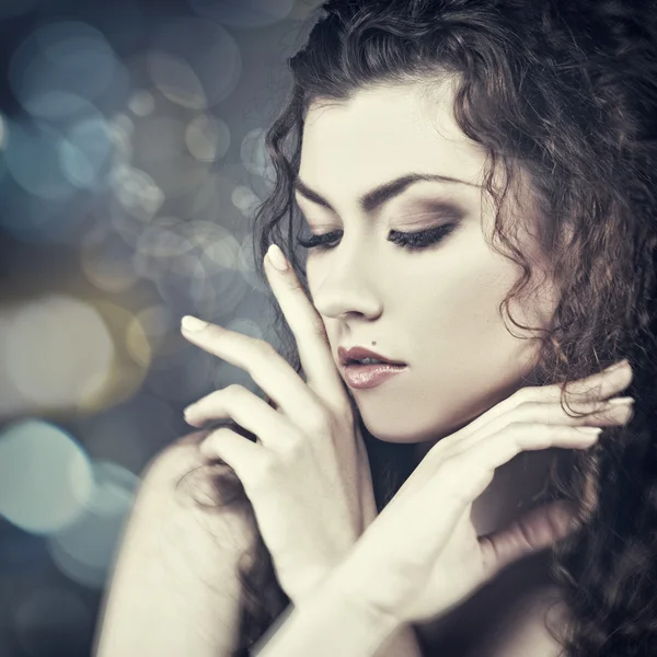 Beautiful woman with curly hair — Stock Photo, Image