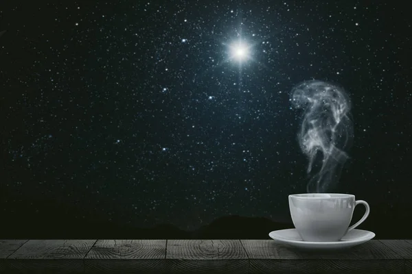 hot coffee on the table on a night background