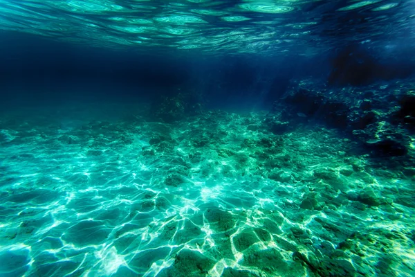 水中のビーチで砂の背景 — ストック写真