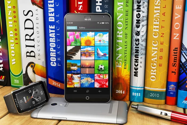 Smartphones en smartwatch op boekenplank — Stockfoto