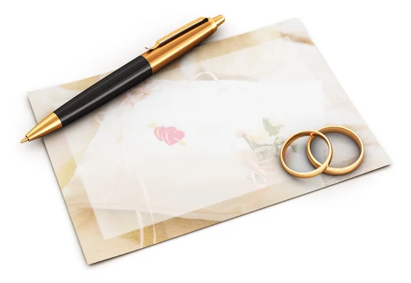 Anéis de casamento, caneta e cartão vazio — Fotografia de Stock
