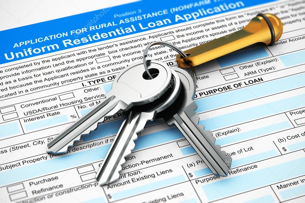 Bunch of house keys on mortgage or loan application form