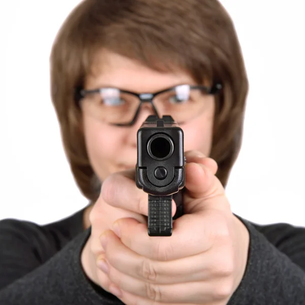 Woman pointing a gun at the camera — Stock Photo, Image