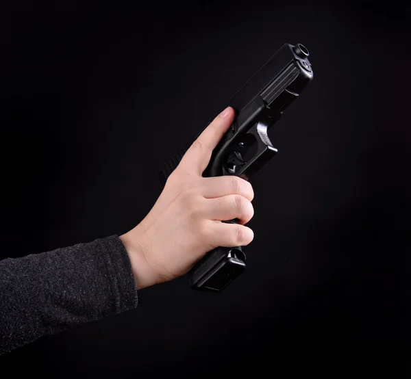 Female hand with gun — Stock Photo, Image