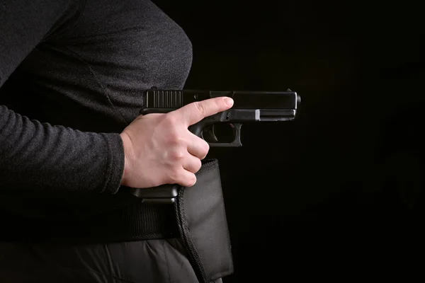 Woman hand with gun pulled — Stock Photo, Image