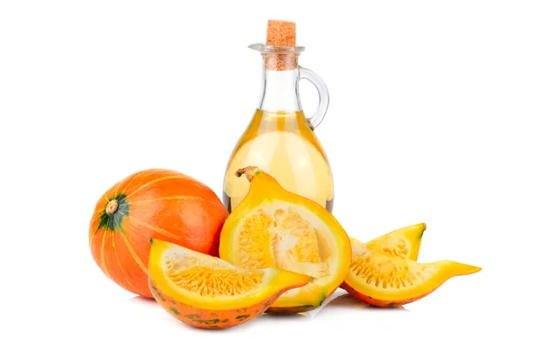 Orange pumpkins with olive oil — Stock Photo, Image