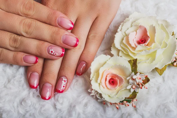 Red french nail art with flower — Stock Photo, Image