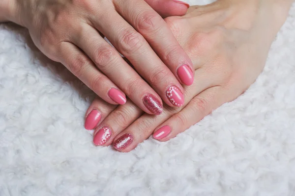 Pink nail art with flower on textile — Stock Photo, Image