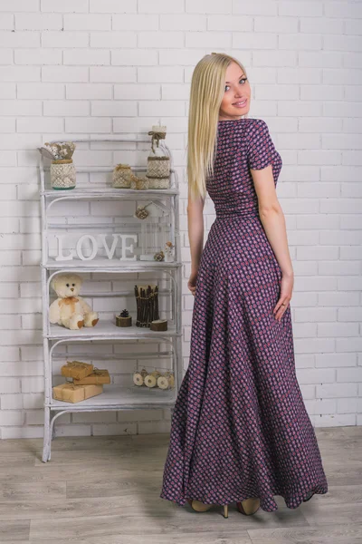 Young woman in abstract print dress