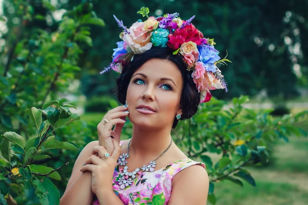 Young attractive woman with coronet of flowers — Stock Photo, Image