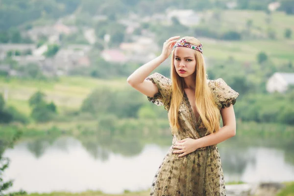 Young queen on the river landscape background — Stock Photo, Image