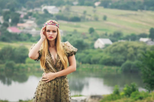 Young queen on the river landscape background — Stock Photo, Image