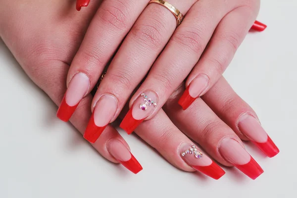 Red french nail art with rhinestones — Stock Photo, Image