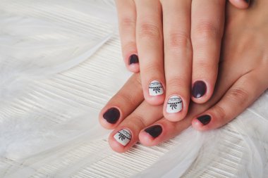 Violet nail art with printed white bow