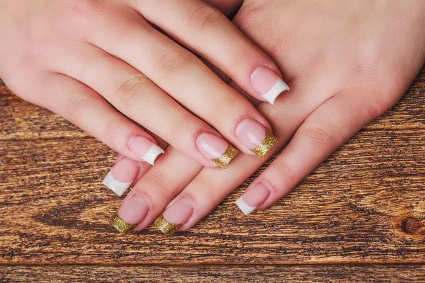 Nail art francese in colore oro — Foto Stock