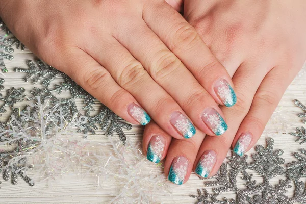 Winter nail art with snowflakes and light blue french — Stock Photo, Image