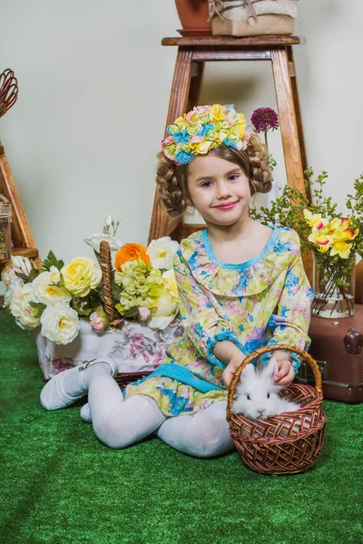 Smiling girl with small bunny — Stock Photo, Image