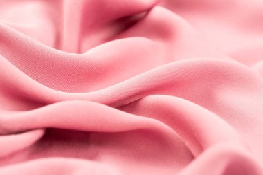 Arkaplan olarak pembe kumaş dokusu, yatay resim.
